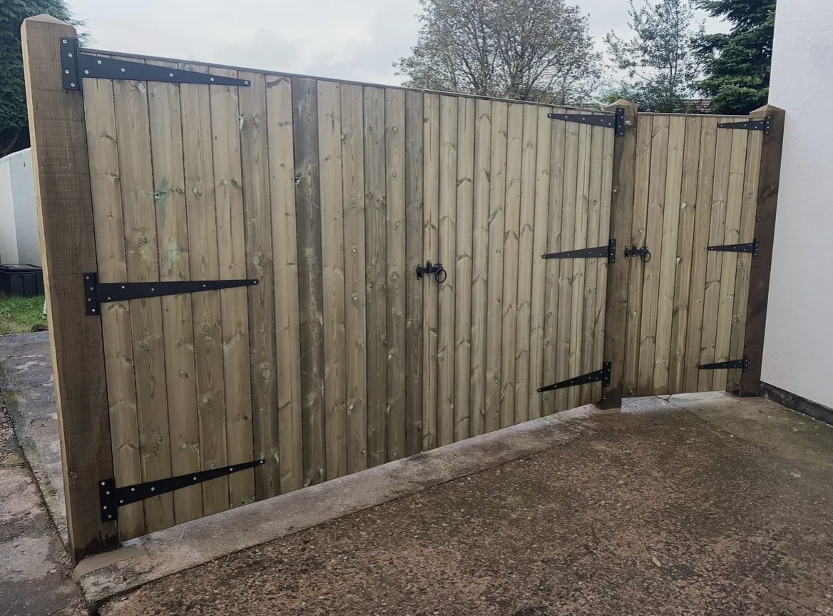 Custom-made Kingswood timber gates with black strap hinges