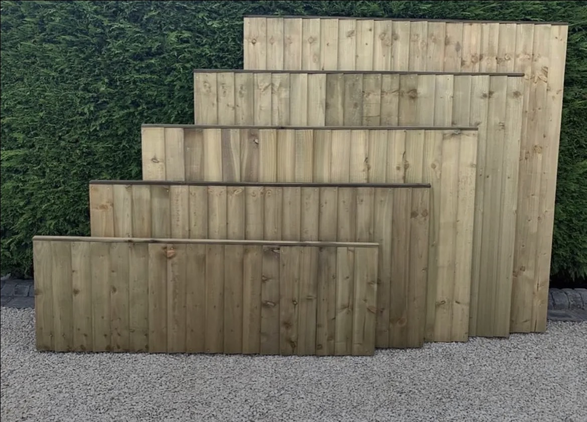Five completed Kingswood timber fence panels in a range of heights